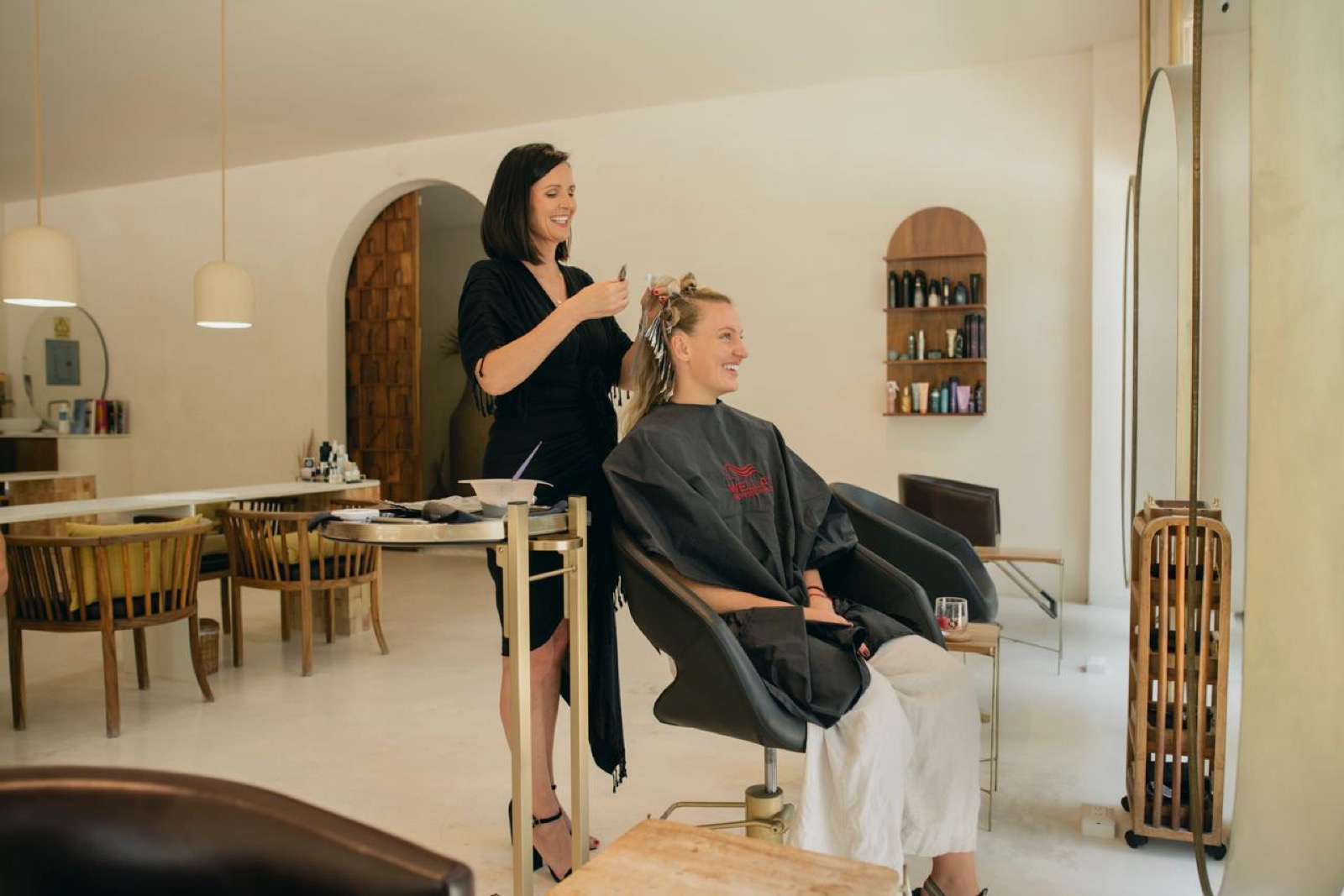 Casa Venus hair stylist and client — Tulum